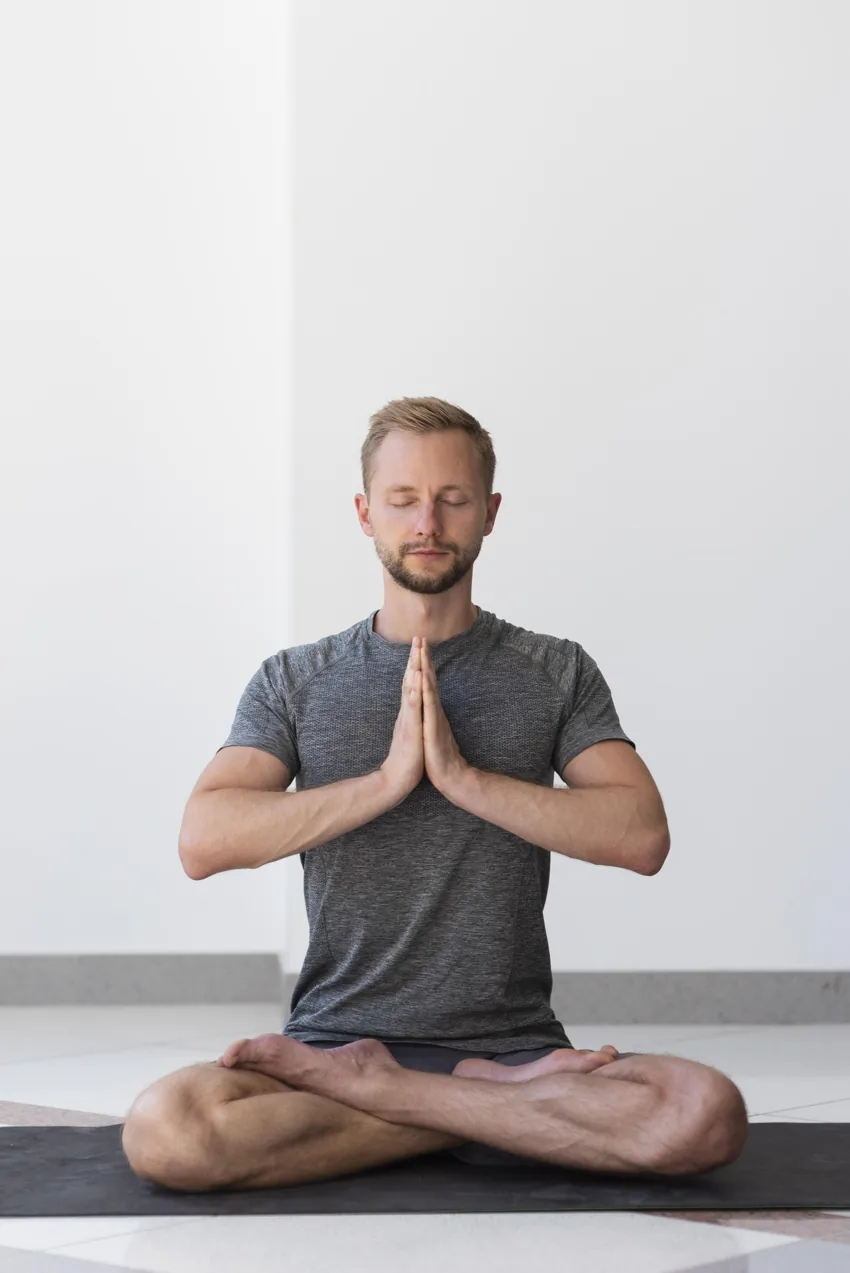 A yoga practitioner seated in meditation